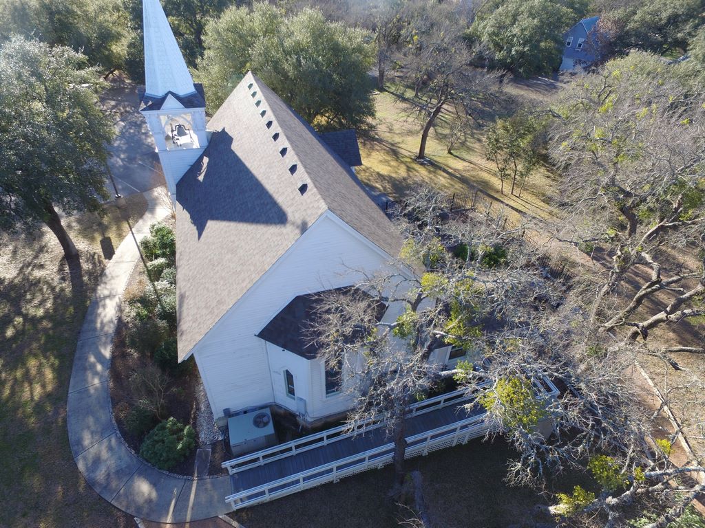 Detailed roof lines and valleys on a historic Salado church roofed by A Classic Roofing