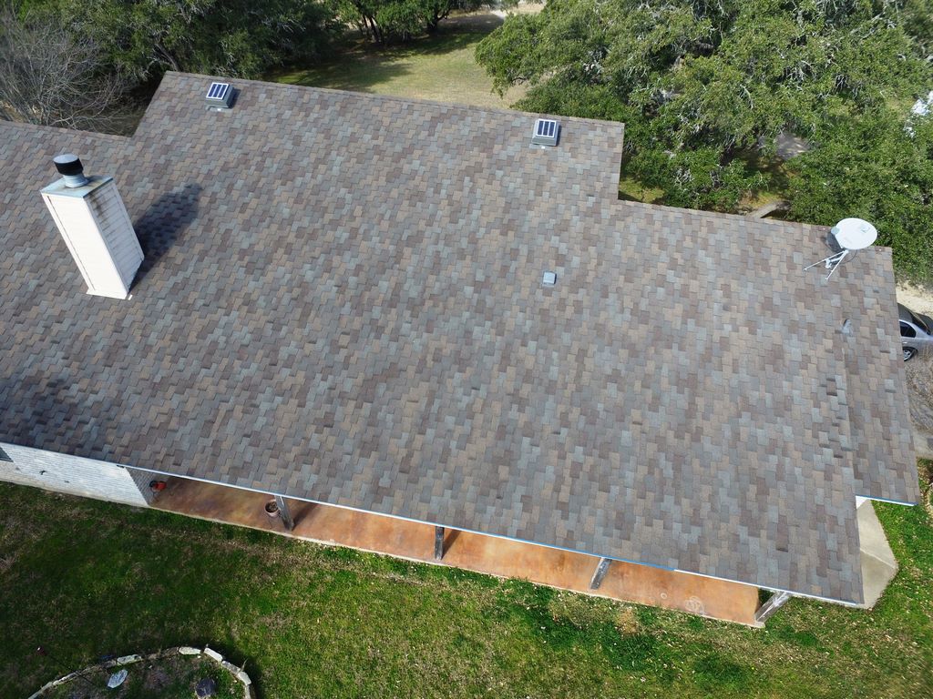 Finished residential shingle roof and clean jobsite after work by A Classic Roofing